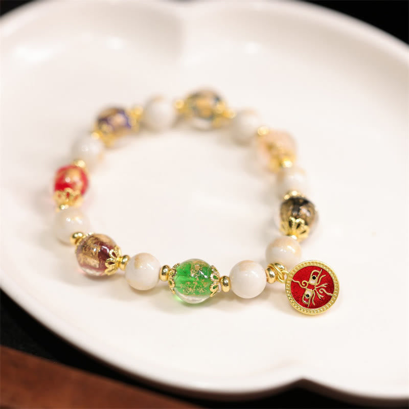 Armband – Wohlstand & Glück & Energie mit Perlen und grünen Steinen golden.