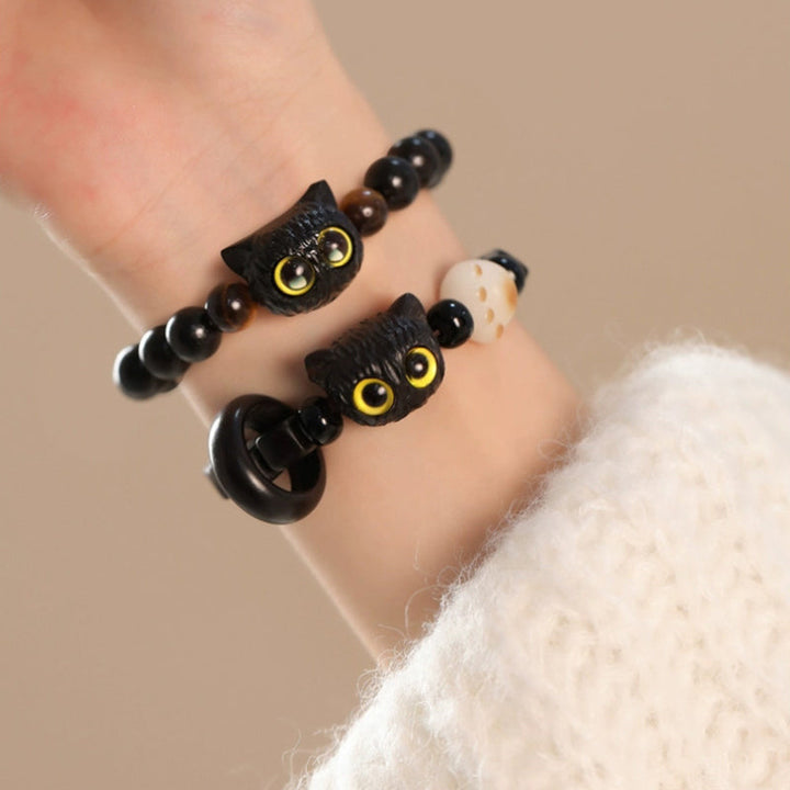 Armband Ebenholz Katze schwarze Perlen Handgelenk getragen elegant
