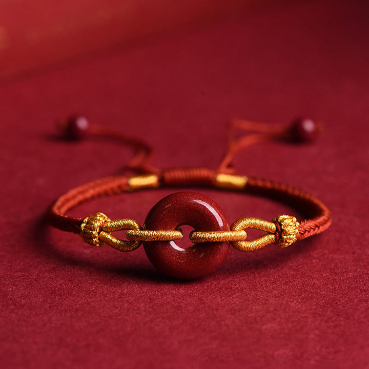 Armband Zinnober – Frieden & Segen Energie mit goldenem Schmuck elegant.