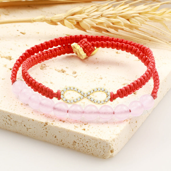 Rotes Armband Kristall Lotus mit rosa Perlen und goldenem Charm