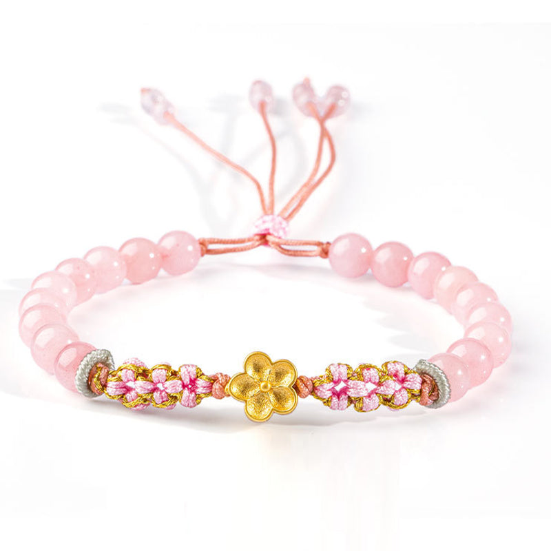 Rosaquarz Armband mit goldenem Blütenanhänger elastisch Perlenarmband