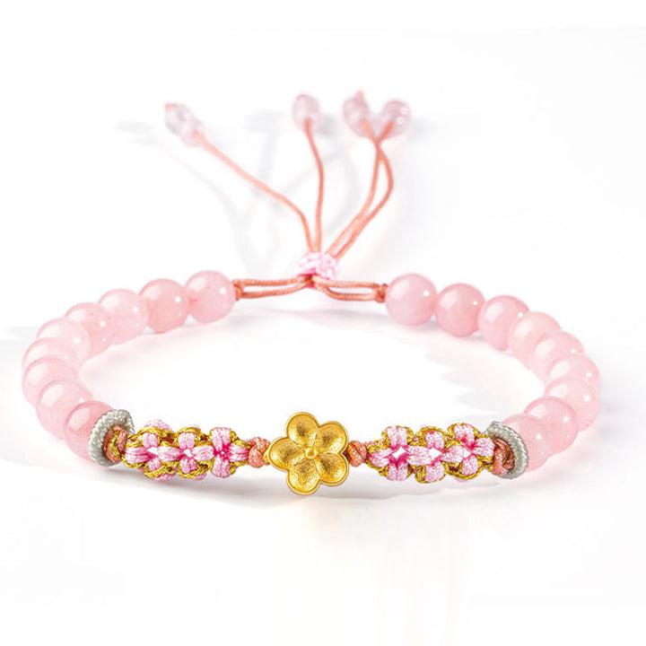 Rosaquarz Armband mit goldenem Blütenanhänger elastisch Perlenarmband