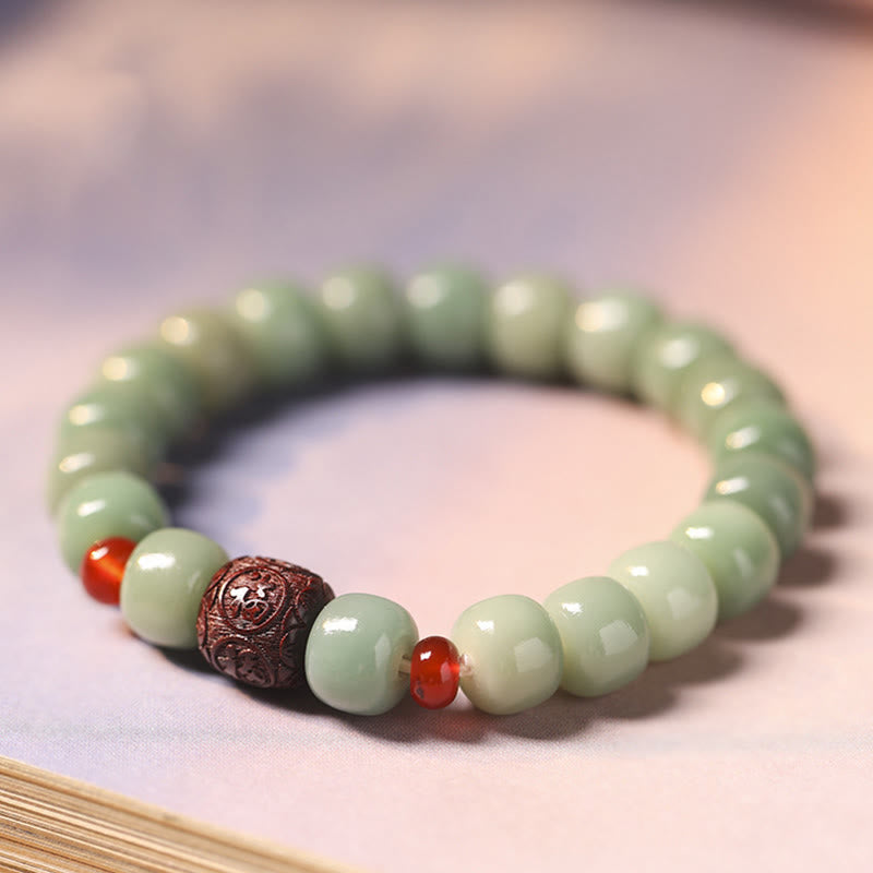 Armband Bodhi Fu-Zeichen Frieden grüne Perlen rote Akzente bronze Verschluss