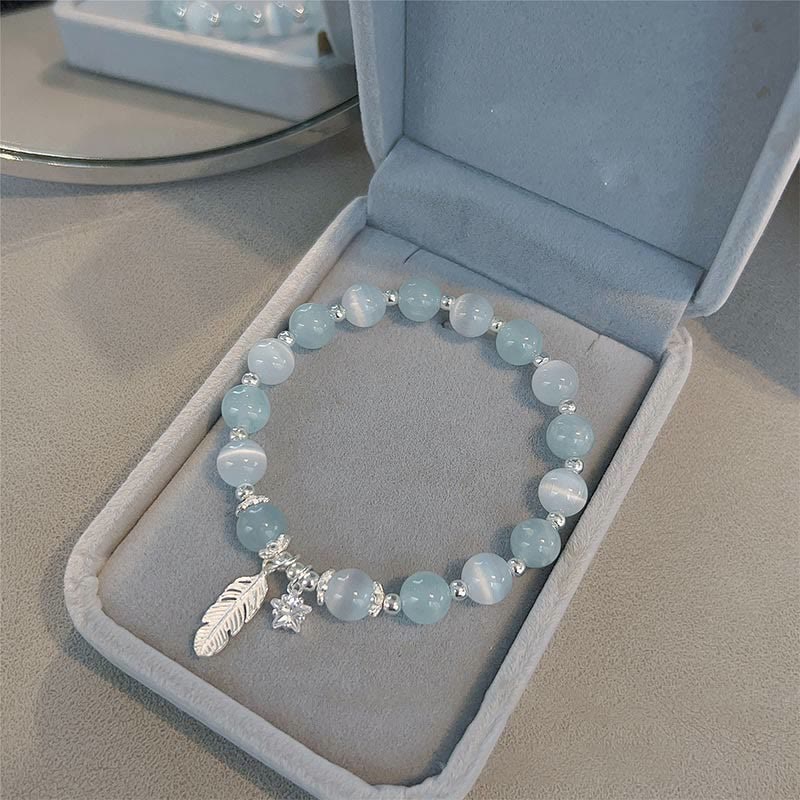 Aquamarin Armband 925 Silber mit Stern Charm und Feder Anhänger.