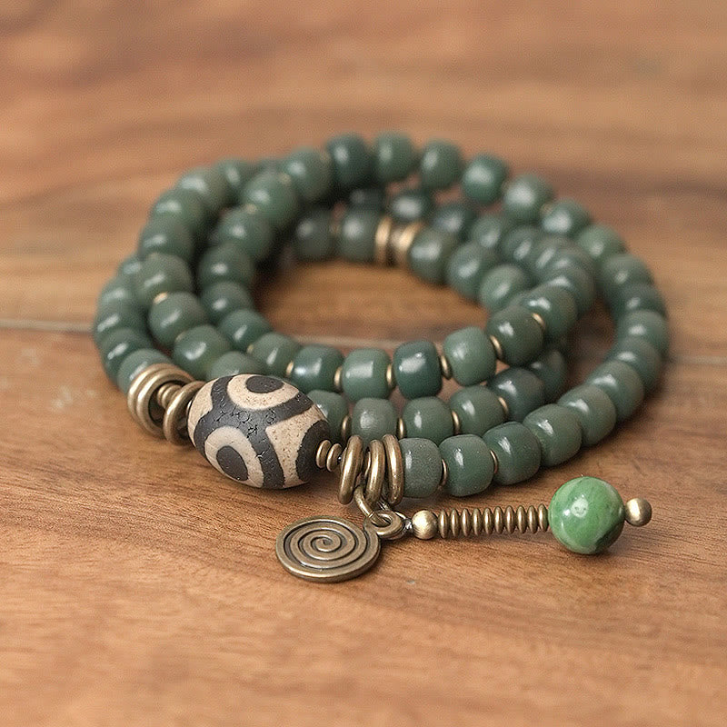 Armband Bodhi – Frieden mit grünen Perlen und Metallakzenten Holz.