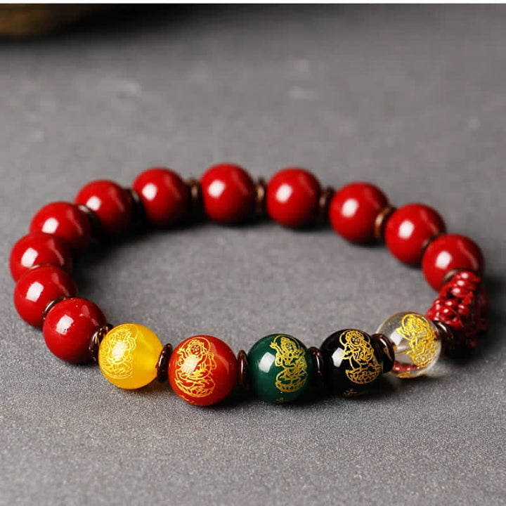 Rotes Armband Zinnober Pixiu mit goldfarbenen Drachen Perlen Wohlstand.