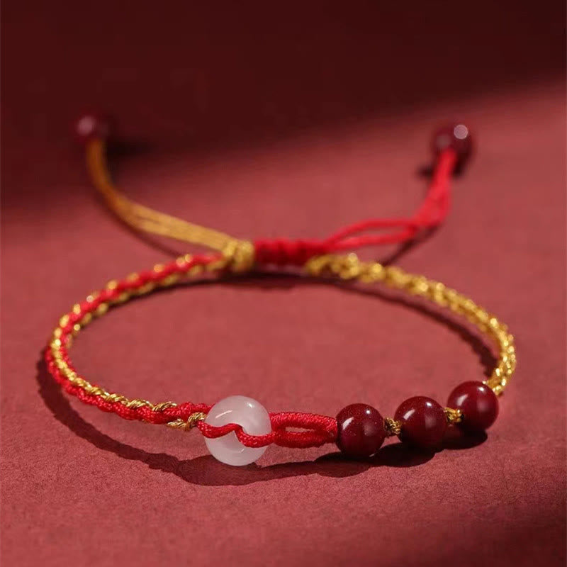 Armband Zinnober Jade – Frieden & Segen mit roten Perlen und weißem Stein