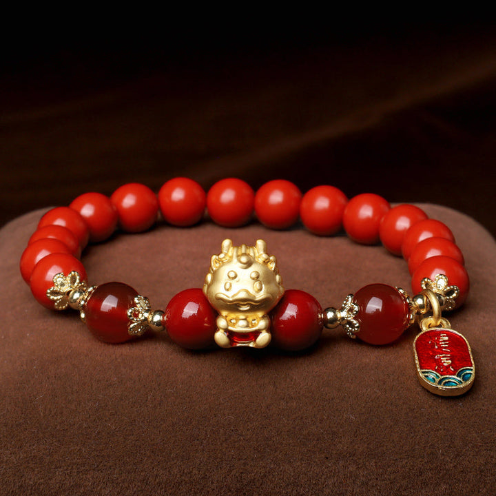 Armband Zinnober Drachen – Schutz rote Perlen goldener Drache Charm