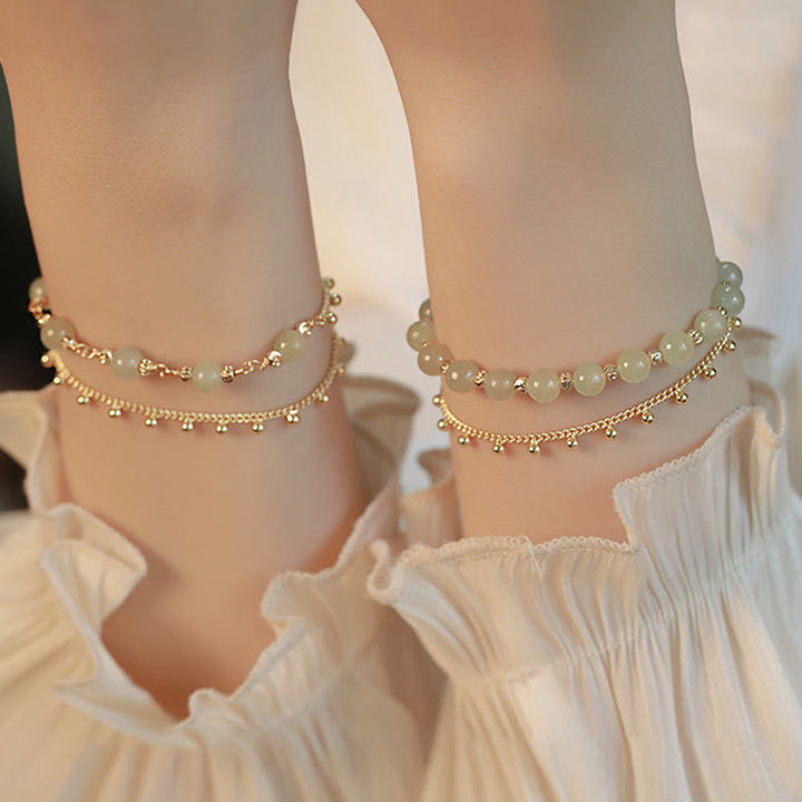 Jade Armband Glück Wohlstand Harmonie goldfarbene Perlen elegant getragen