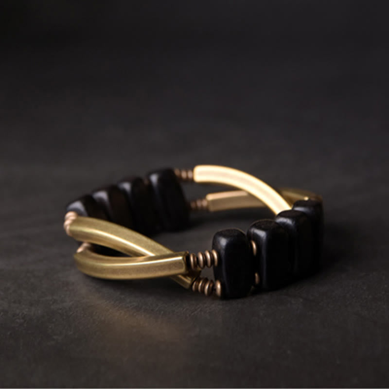 Armband Kupfer Ebenholz Balance Energie schwarze Perlen elegant getragen