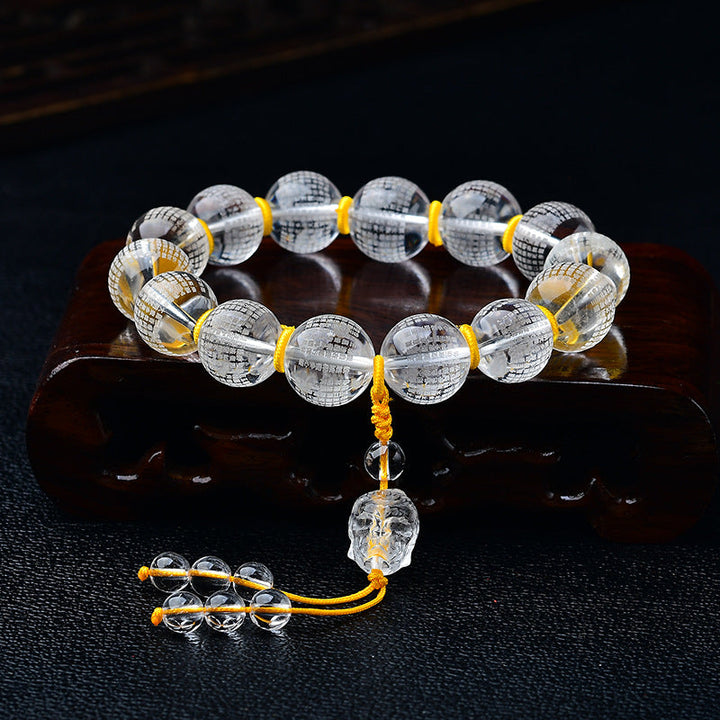 Armband Weißer Kristall Herzsutra mit goldenem Faden elegant.