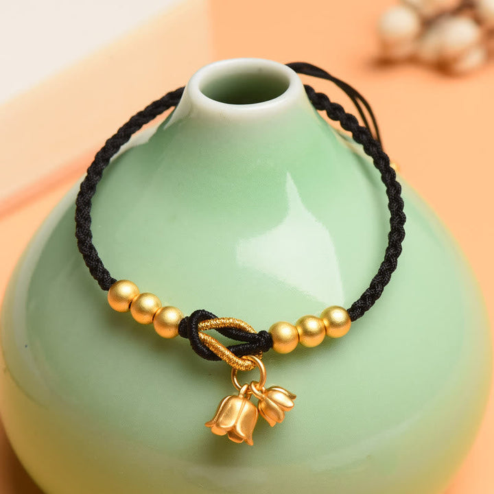 Armband – Schutz & Glück Segen schwarze Kordel goldene Perlen Glocke.