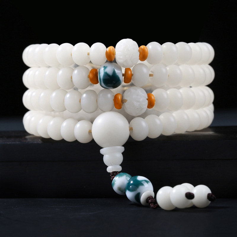 Weißes Bodhi Lotus Armband mit grünem Stein elastisch Naturperlen
