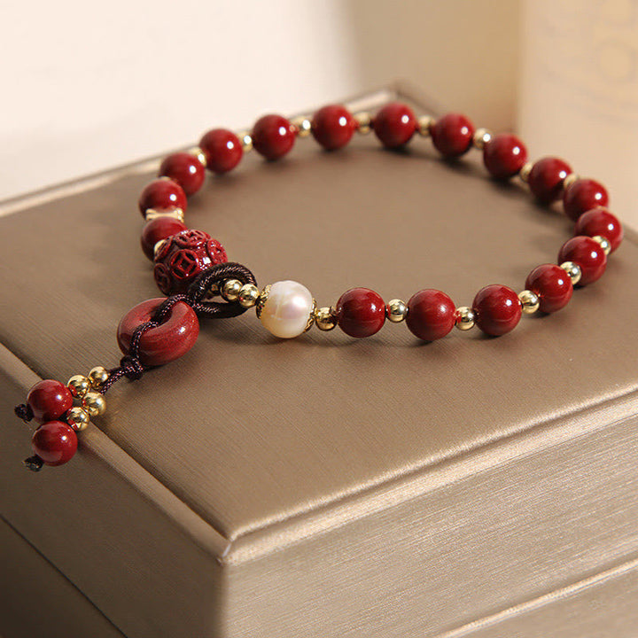 Armband Zinnober Kupfer mit Perle und goldenen Perlen eleganz.