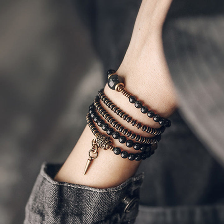 Armband Obsidian Kupfer mehrschichtig am Handgelenk getragen schwarz