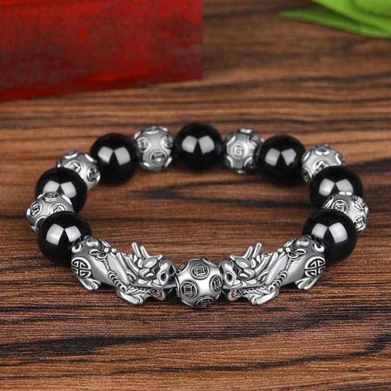 Armband Obsidian Pixiu mit schwarzen Steinen und silbernen Perlen Holz.