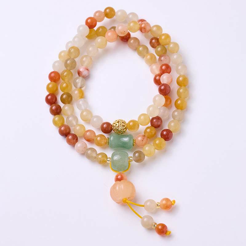 Armband Jade Gold mit bunten Natursteinen und Quasten elegant.