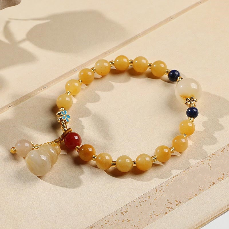 Jade Armband Gold mit gelben Steinen und Anhänger elegant