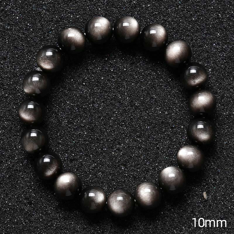 Silbernes Obsidian Armband Schutz schwarze glänzende Perlen Nahaufnahme Größenvergleich