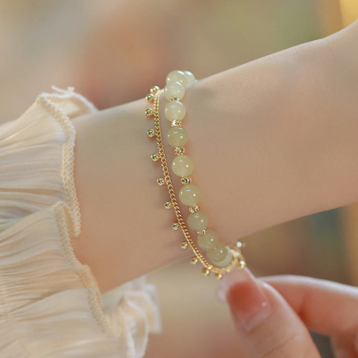 Jade Armband Glück Wohlstand grüne Perlen gold Perlenarmband elegant getragen