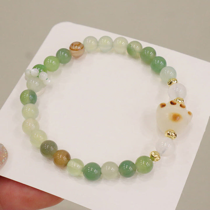 Armband Achat Bodhi Katze grüne Perlen goldene Akzente elegant.
