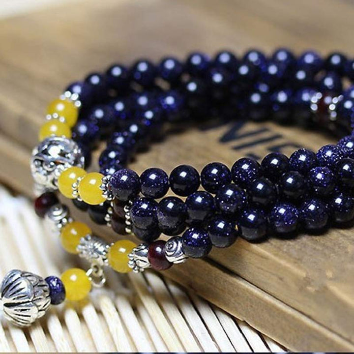 Mala – Wohlstand Armband dunkelblaue Perlen gelbe Akzente Silber