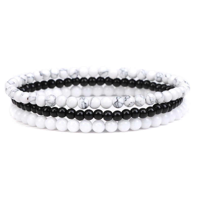Armband Kristall – Frieden weiß schwarz Perlen elastisch Naturstein