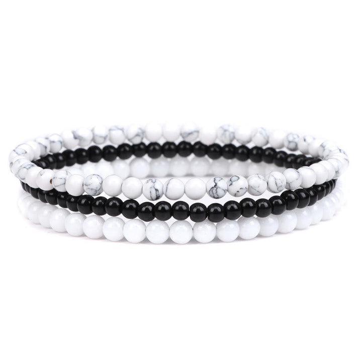 Armband Kristall – Frieden weiß schwarz Perlen elastisch Naturstein