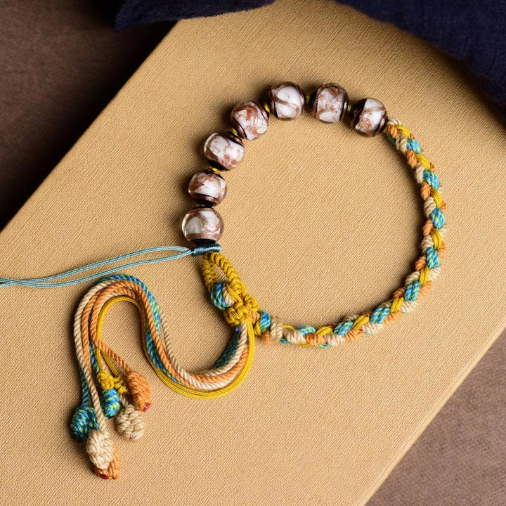Armband Bunt Liuli Glas Perle – Glück mit Seilgeflecht Handgelenk getragen