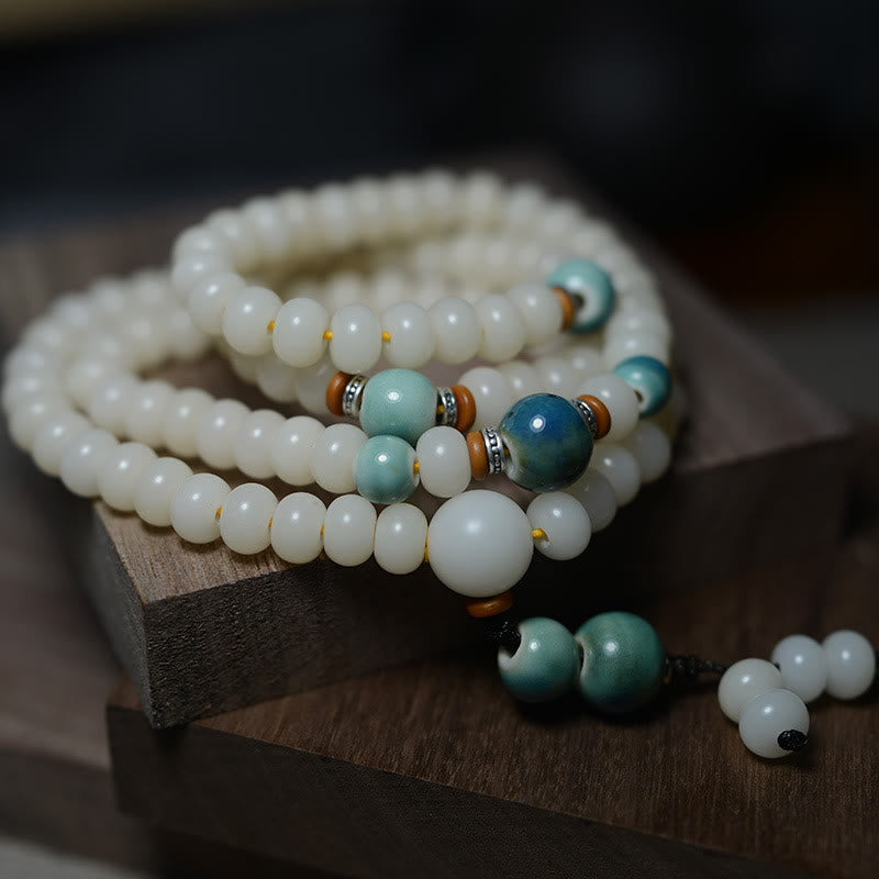 Weiße Bodhi Mala 108 Perlen Armband mit türkisen Akzenten Ruhe
