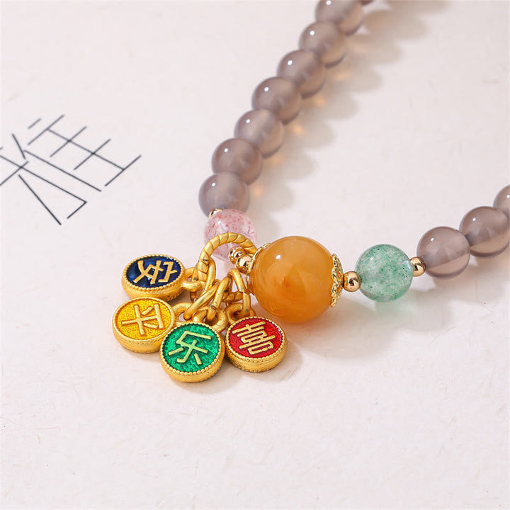Armband Achat mit goldenen Charms Naturstein Perlen elastisch.