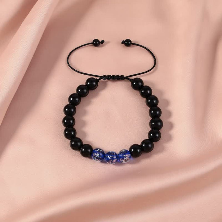 Armband Schwarzer Obsidian – Stärke mit blauen Perlen elegant