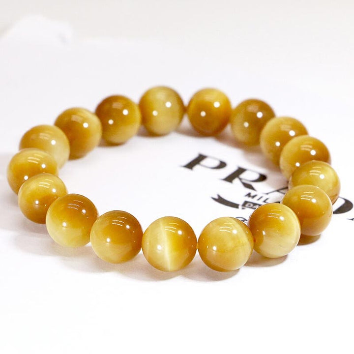 Armband Tigerauge Kristall – Heilung goldbraune Perlen Nahaufnahme Flat Lay