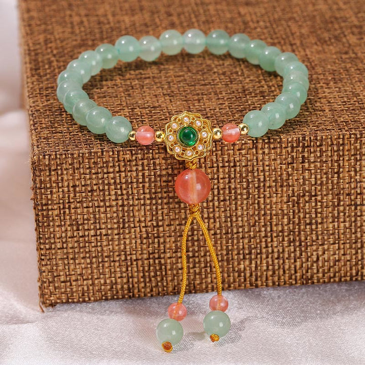 Armband Grüner Aventurin mit rosa Perlen und goldenem Anhänger elegant.