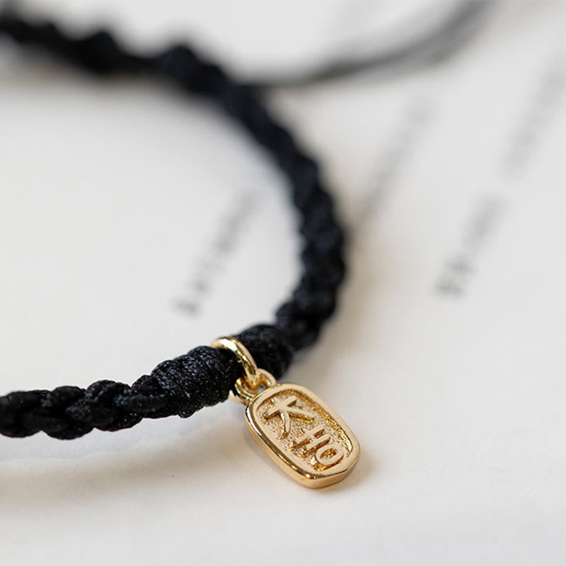 Armband – Frieden schwarzes Seil goldener Anhänger elegant minimalistisch