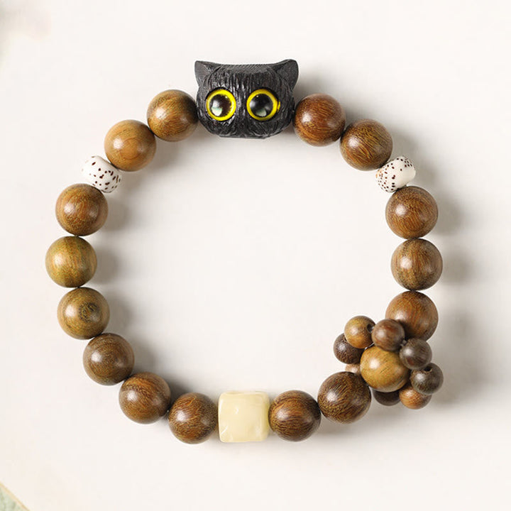 Armband Sandelholz Ebenholz Katze mit gelben Augen Perlen