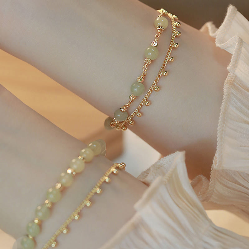 Jade Armband Glück Wohlstand grüne Steine goldene Perlen elegant Handgelenk