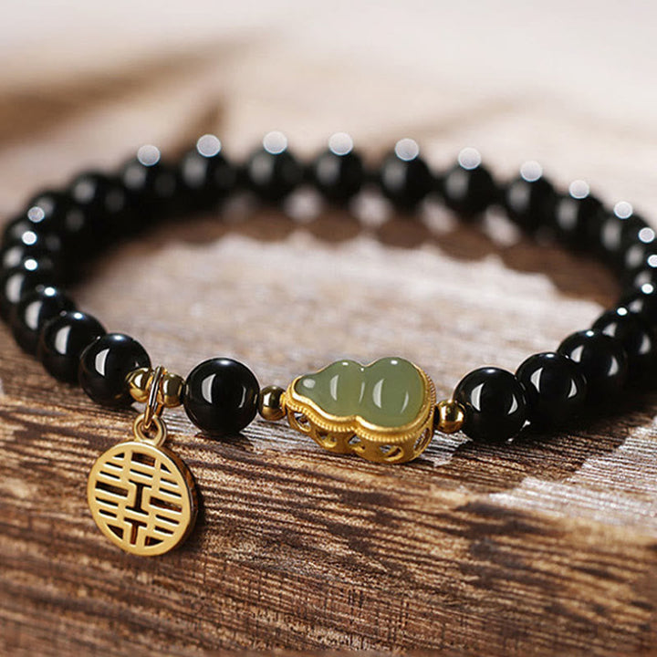 Armband Schwarzer Obsidian Jade mit goldenem Pixiu Charm elegant.