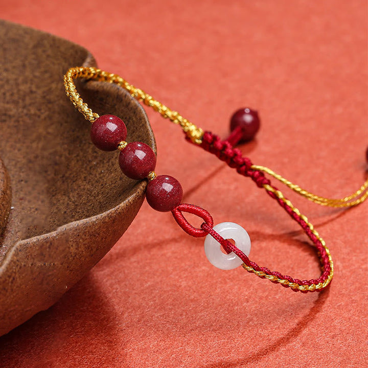 Armband Zinnober Jade Frieden Segen rote Perlen goldene Schnur elegant