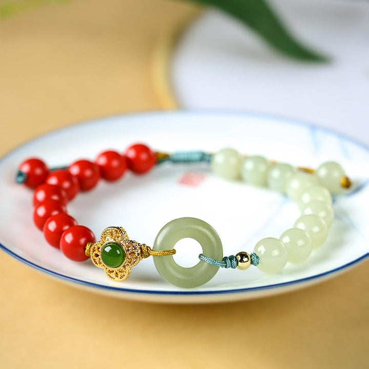 Armband Zinnober Jade Segen Energie rote grüne Perlen Glücksbringer.