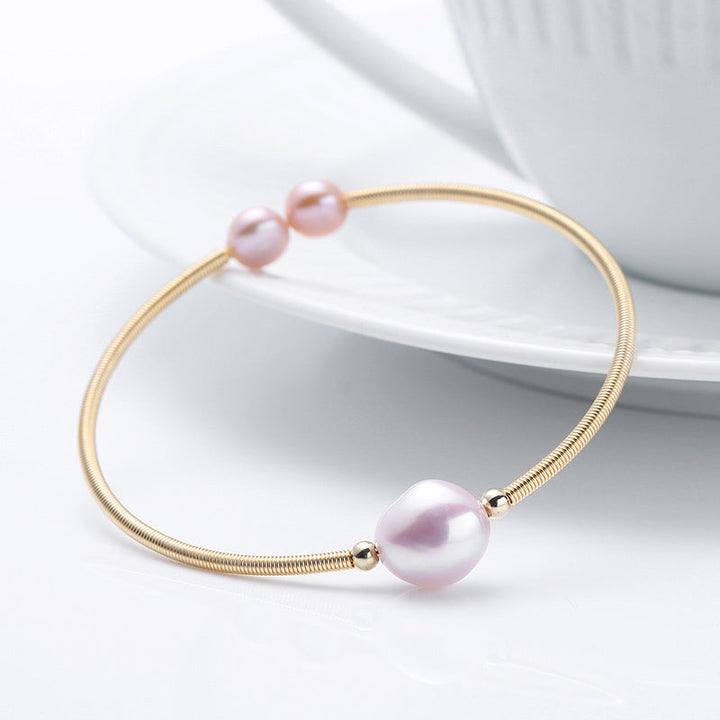 Armband Perle – Wohlstand rosafarbene Perle goldfarbenes Schmuckarmband elegant