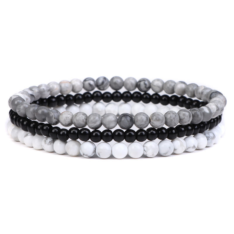 Armband Kristall – Frieden mit grau, schwarz und weiß Perlen elegant.