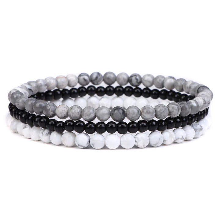 Armband Kristall – Frieden mit grau, schwarz und weiß Perlen elegant.