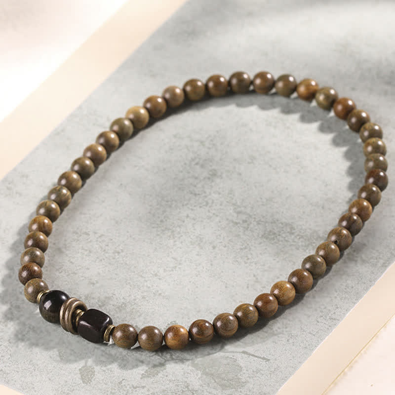 Armband Sandelholz Kristall mit schwarzem Stein Perlen elastisch