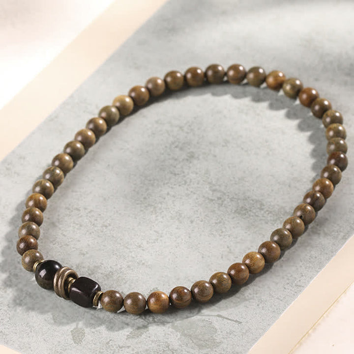 Armband Sandelholz Kristall mit schwarzem Stein Perlen elastisch