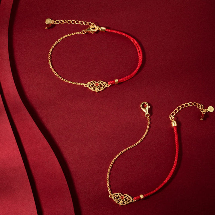 Rotes Armband – Glück & Stärke & Energie mit goldenem Ornament Paar.