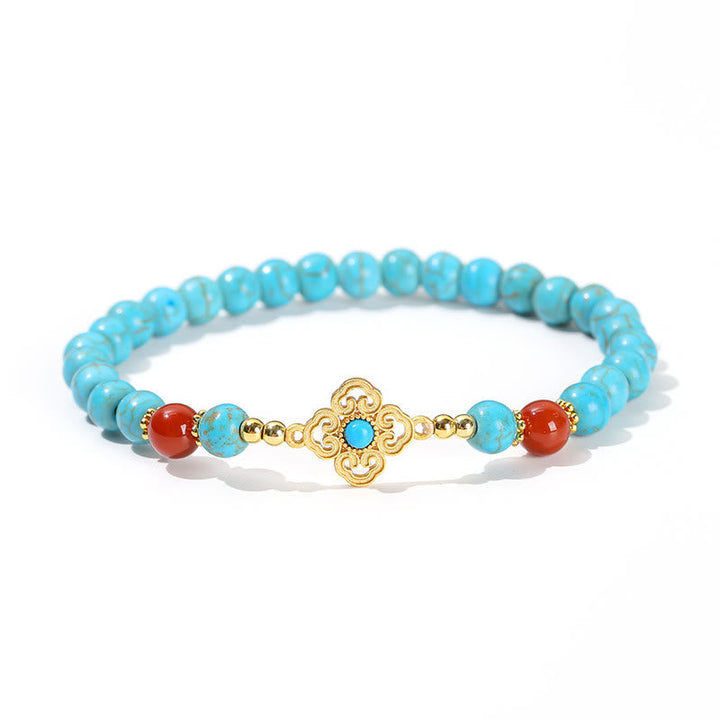 Armband Türkis – Schutz & Balance mit goldenem Ornament und roten Steinen