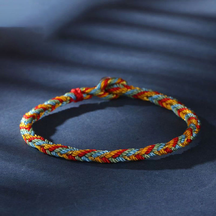 Mehrfarbiges Armband Flachlage gedreht Rot Blau Gold Schutz Glück