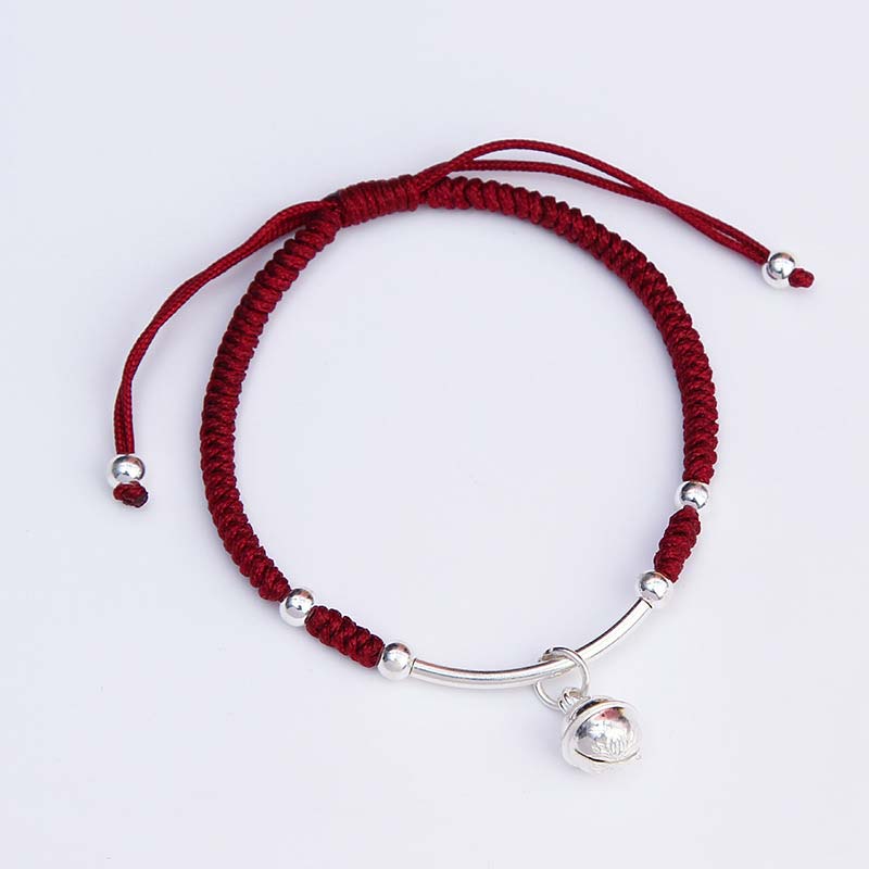 Rotes Schnur Armband mit Silber Glocke Anhänger Flachlage Glück