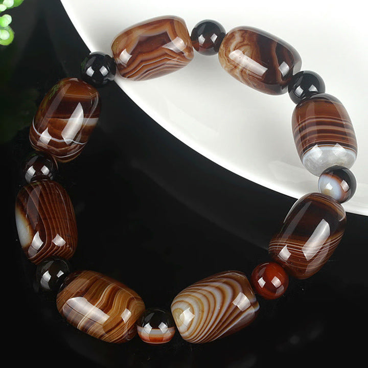 Armband Onyx mit braunen Steinen Glück Mut elastisch natürlich.